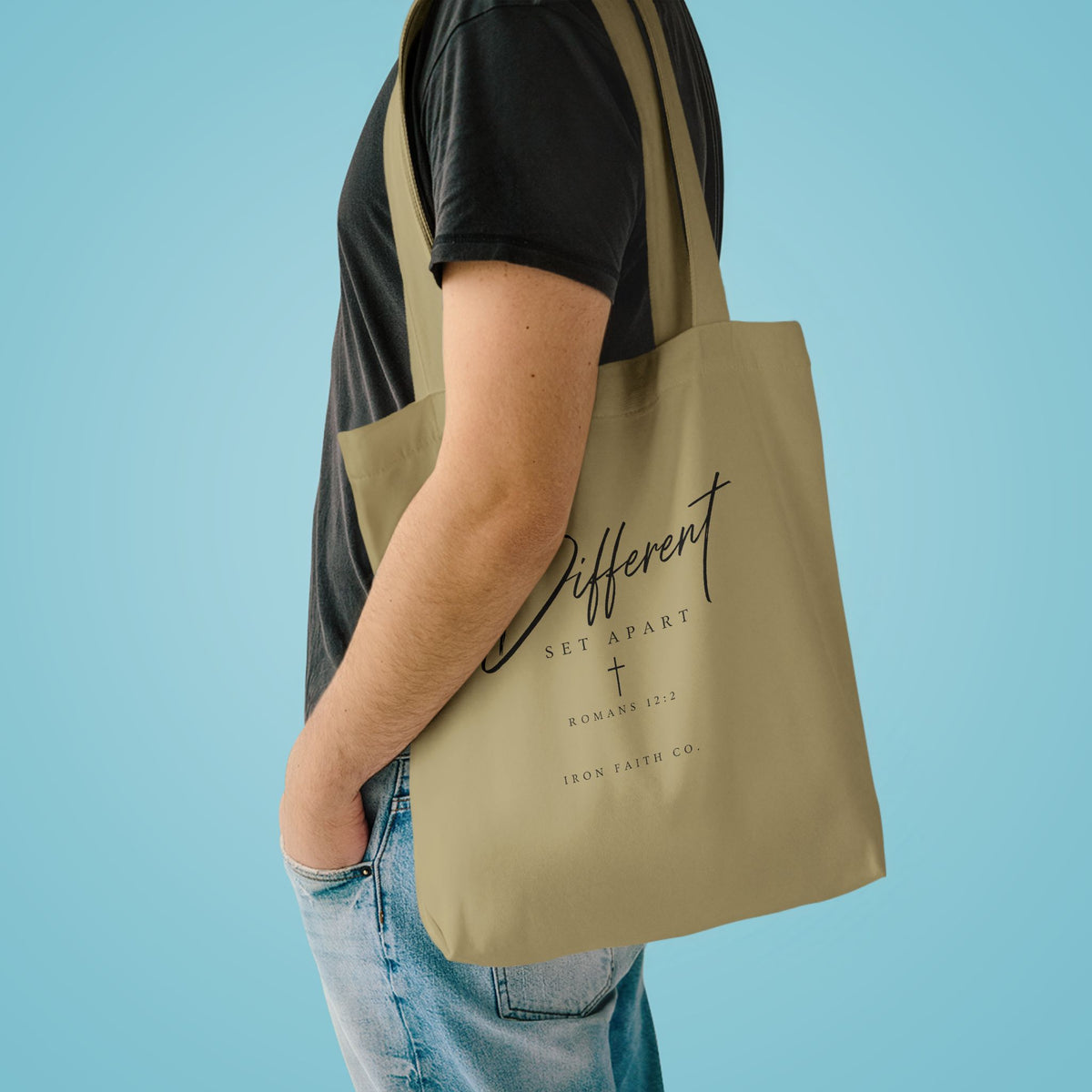 The Different Romans 12:2 Tote Bag shown in a styled everyday scene (product mockup)
