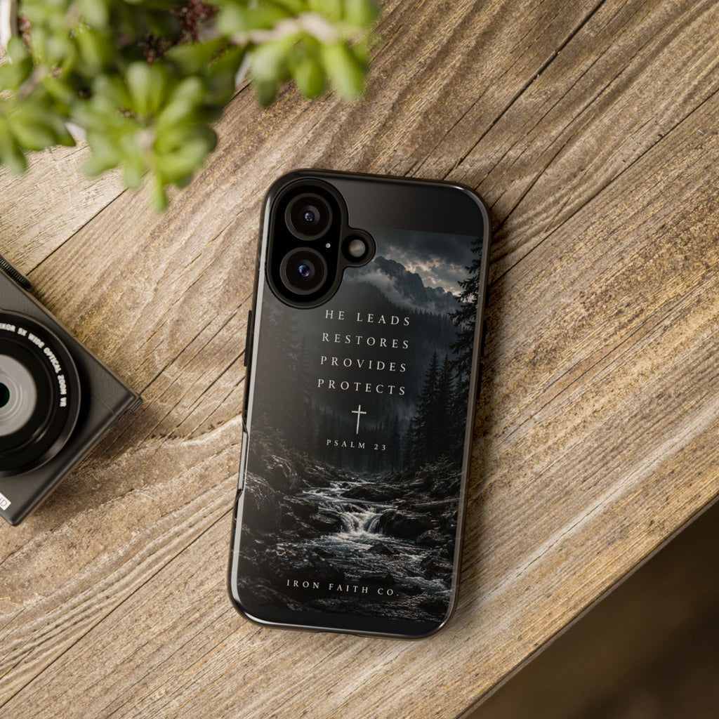 The He Leads Psalm 23 Phone Case shown in a styled everyday scene (product mockup)