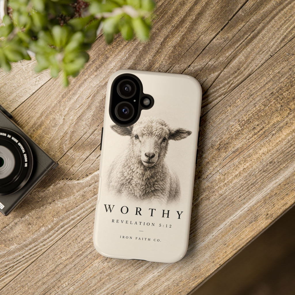 The Worthy Revelation 5:12 Phone Case shown in a styled everyday scene (product mockup)