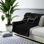 Different Romans 12:2 Sherpa Fleece Blanket draped over a gray sofa in a living room – product mockup