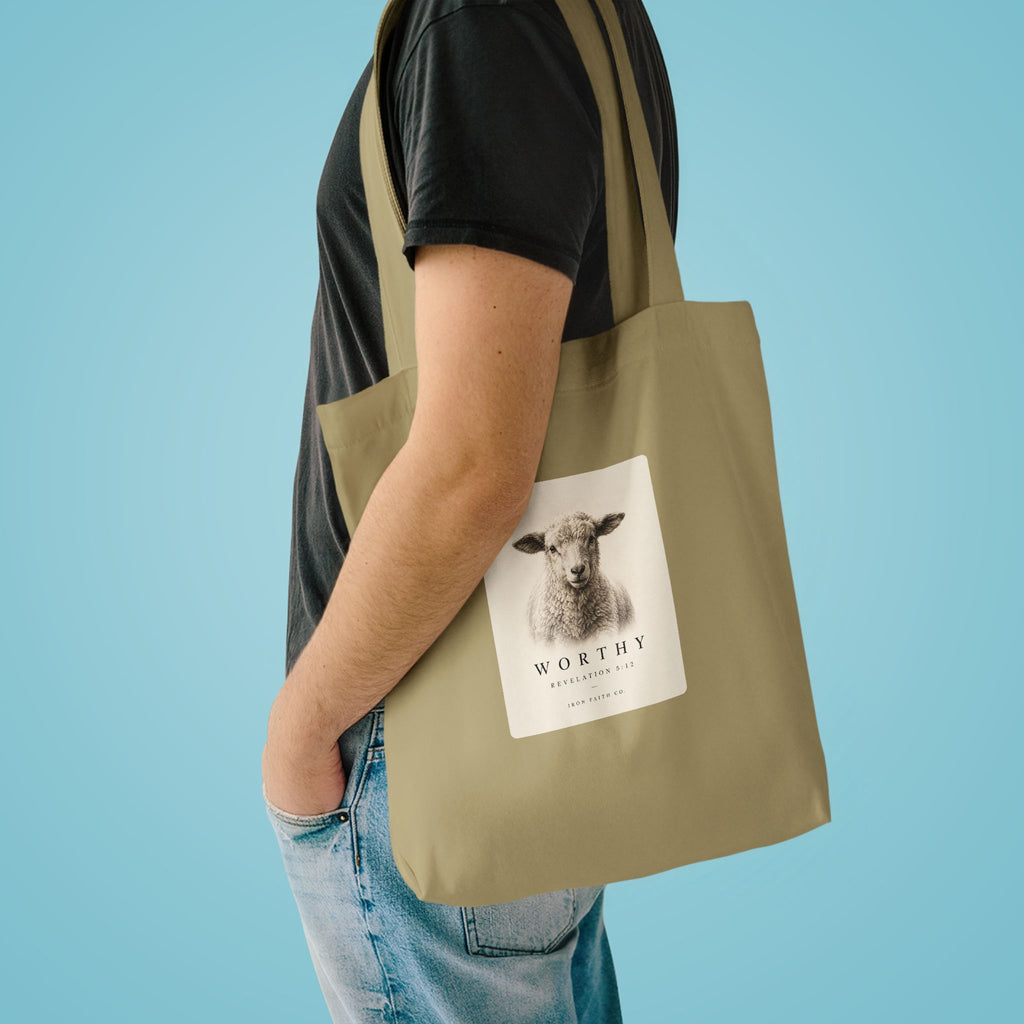 The Worthy Revelation 5:12 Tote Bag shown in a styled everyday scene (product mockup)