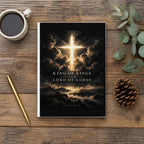 The King of Kings Revelation 19:16 Hardcover Journal on a wooden table with coffee, a pen and a pine cone (digitally composited scene image)