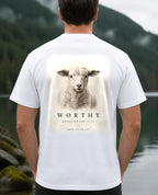 Fictional model wearing the Worthy Revelation 5:12 Tee – Back Print in White, back view, Pacific Northwest scene (digitally composited lifestyle image)