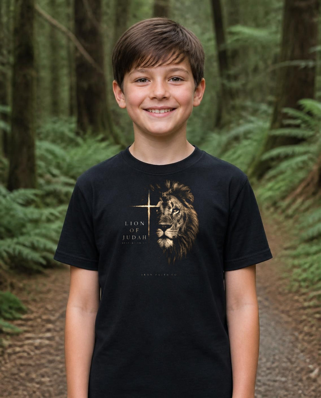 Fictional model wearing the Lion of Judah Youth Tee in Black, Pacific Northwest scene (digitally composited lifestyle image)