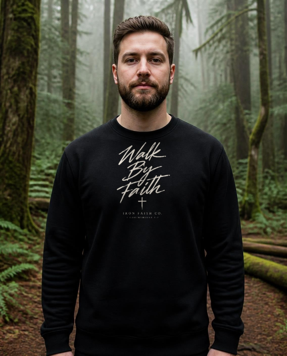 Fictional model wearing the Walk By Faith Crewneck in Black, Pacific Northwest scene (digitally composited lifestyle image)