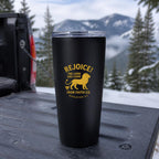 Rejoice! The Lord Has Come Insulated Tumbler, 20oz in Black on a truck tailgate with snowy mountains behind – digital mockup