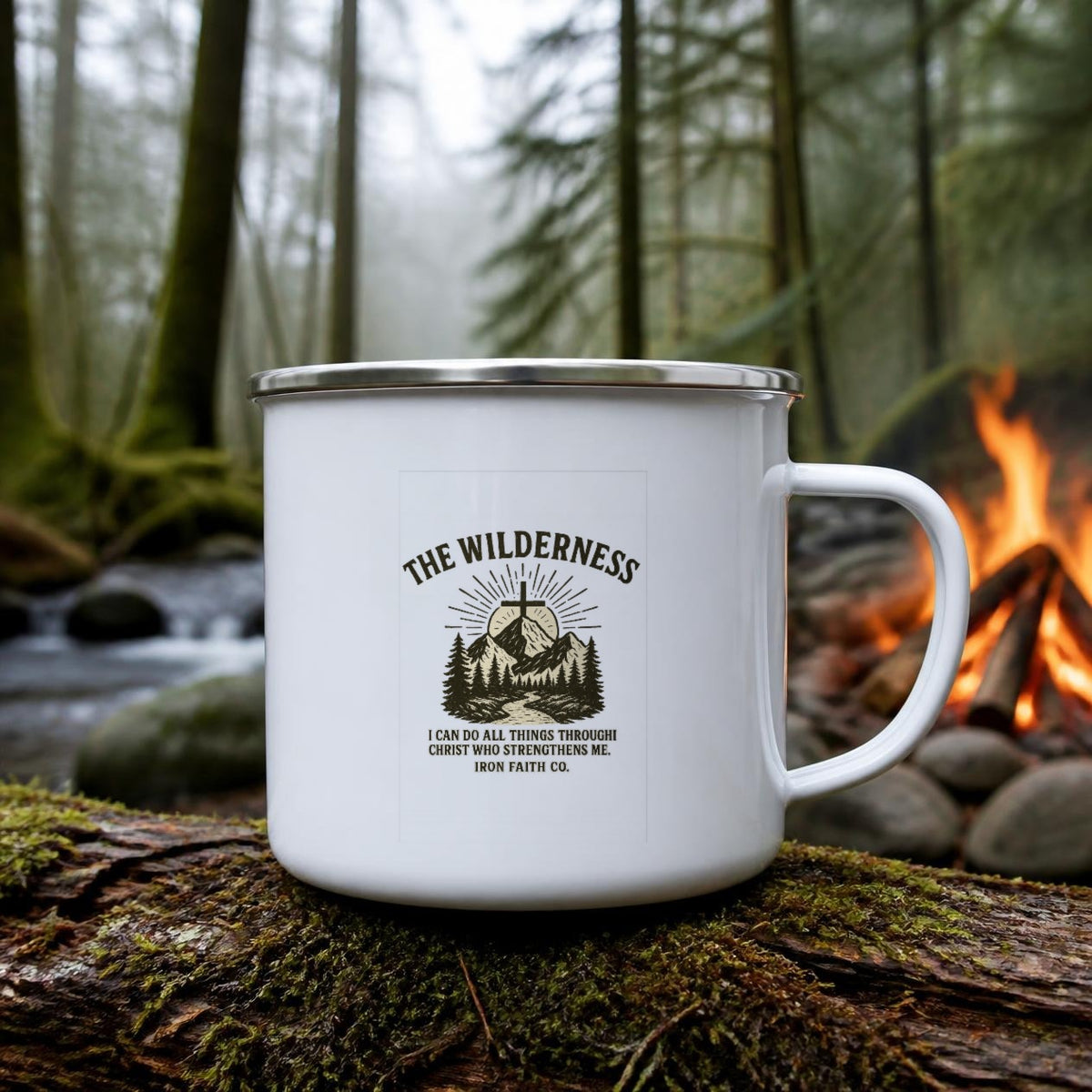 The Wilderness Enamel Camp Mug (white enamel) on a mossy log beside a campfire – digital mockup